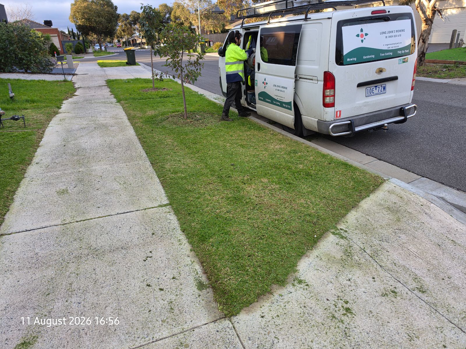 Long John's Mowing van and crew after a completed job